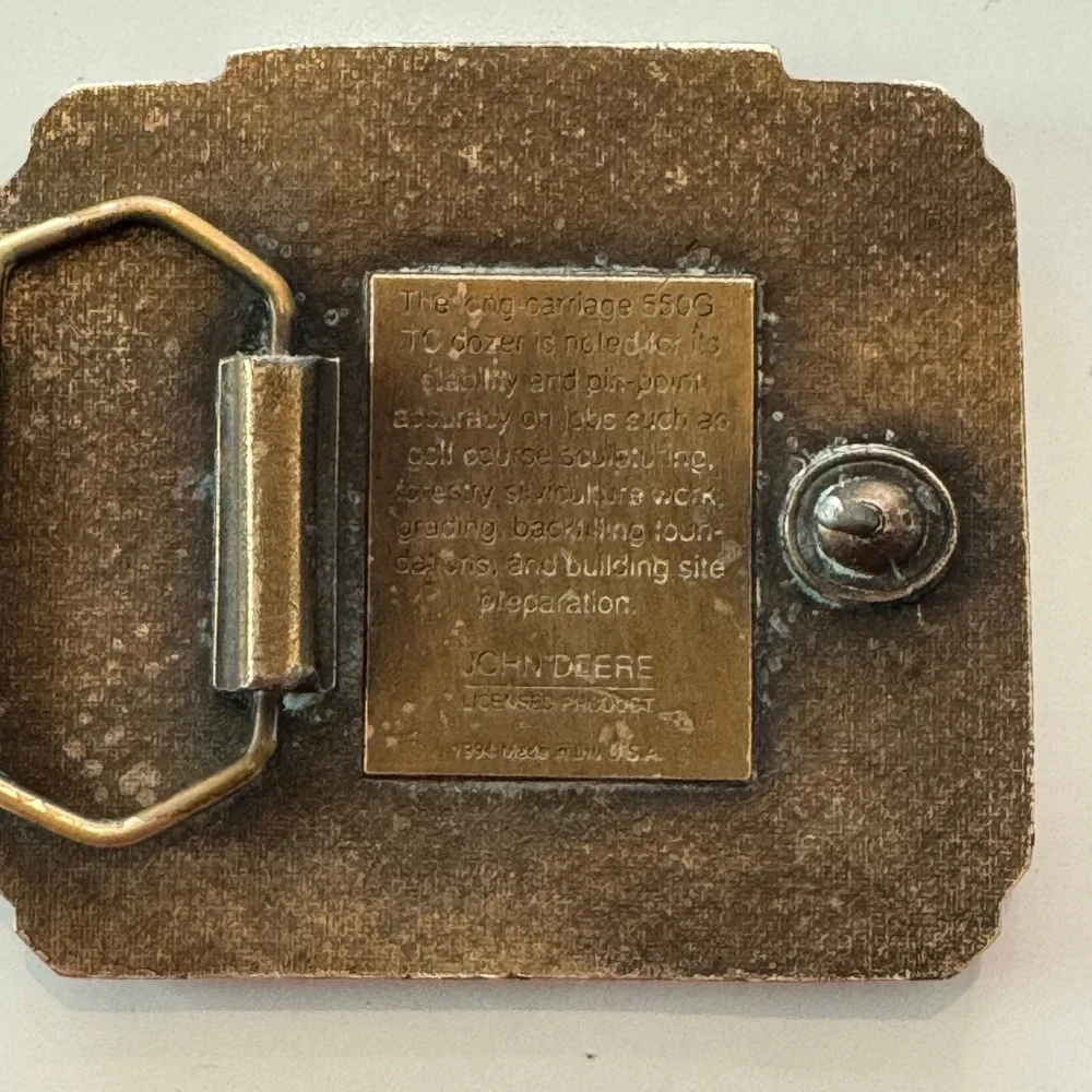 John Deere vintage brass